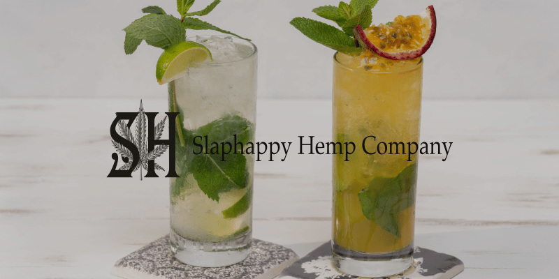 two refreshing beverages sitting on coasters on a table